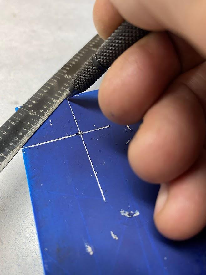 A ruler is being used as a straight edge for semi-precise work.
