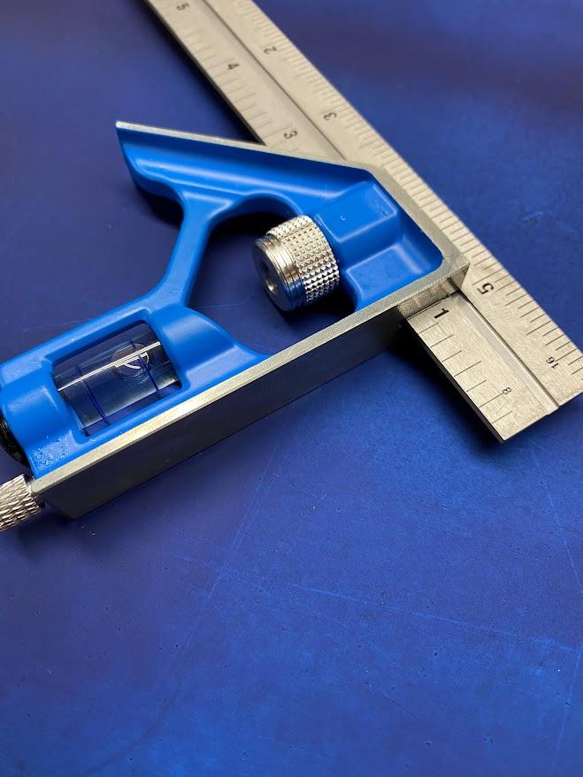 A combination square has an adjusting nut to lock the beam in place and a 45 degree back side.