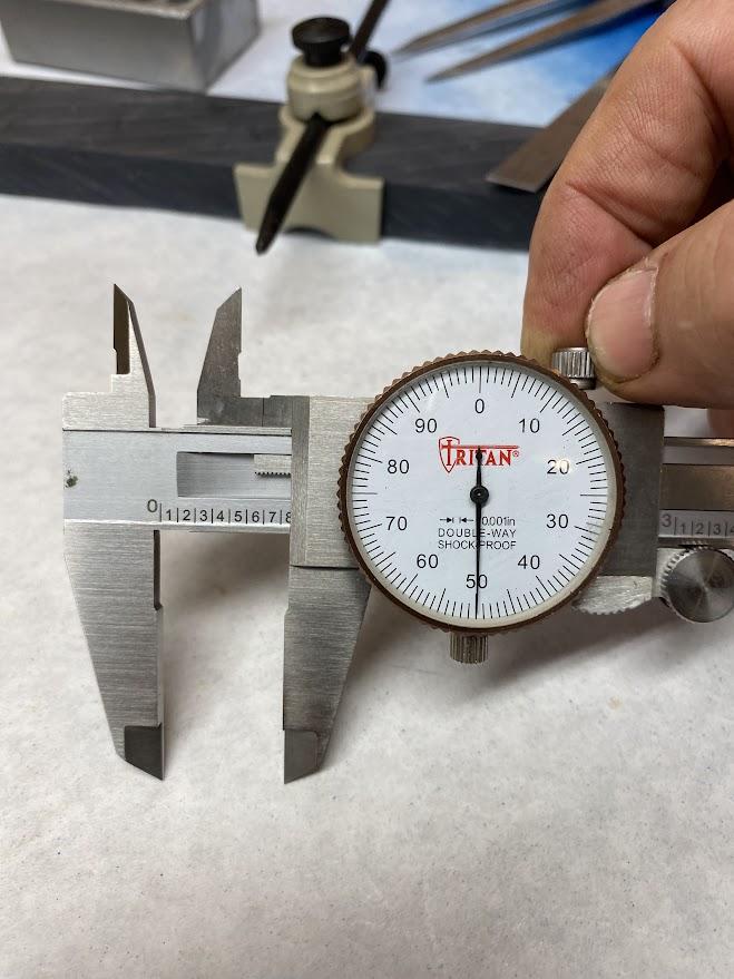 The movable jaw lock being applied on a slide caliper.