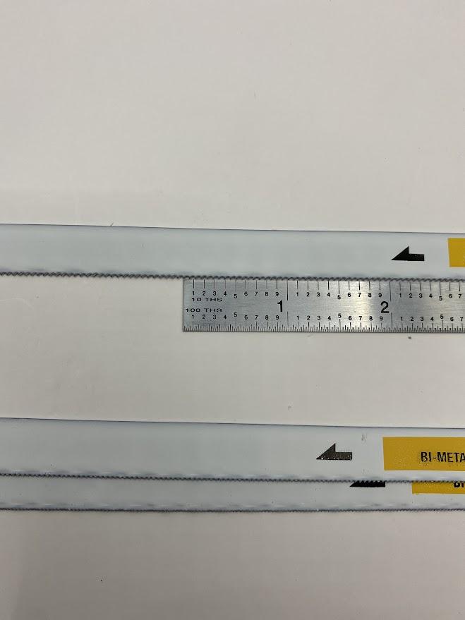 A ruler is placed next to an 18 TPI saw blade.