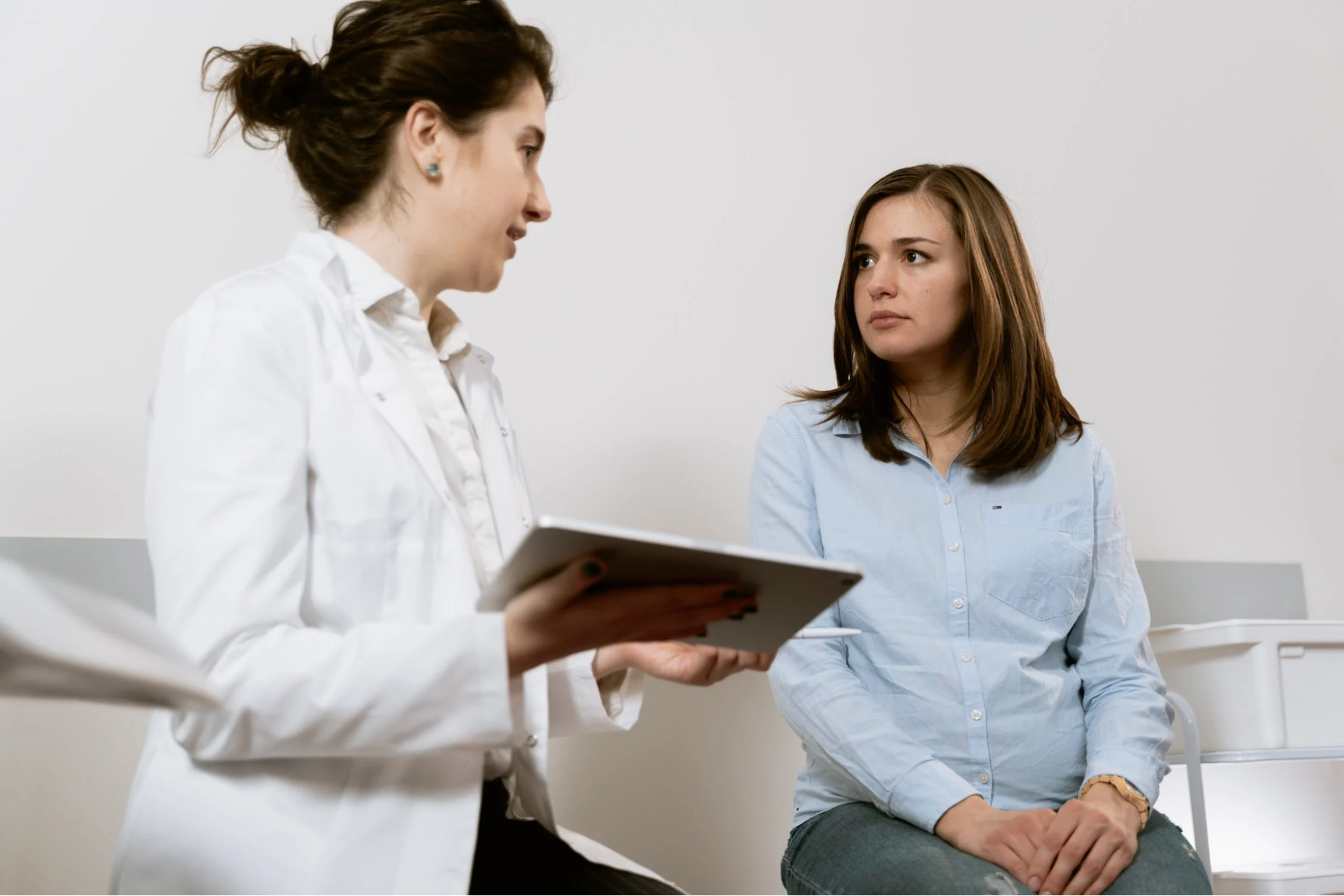 Medical provider talking with a patient