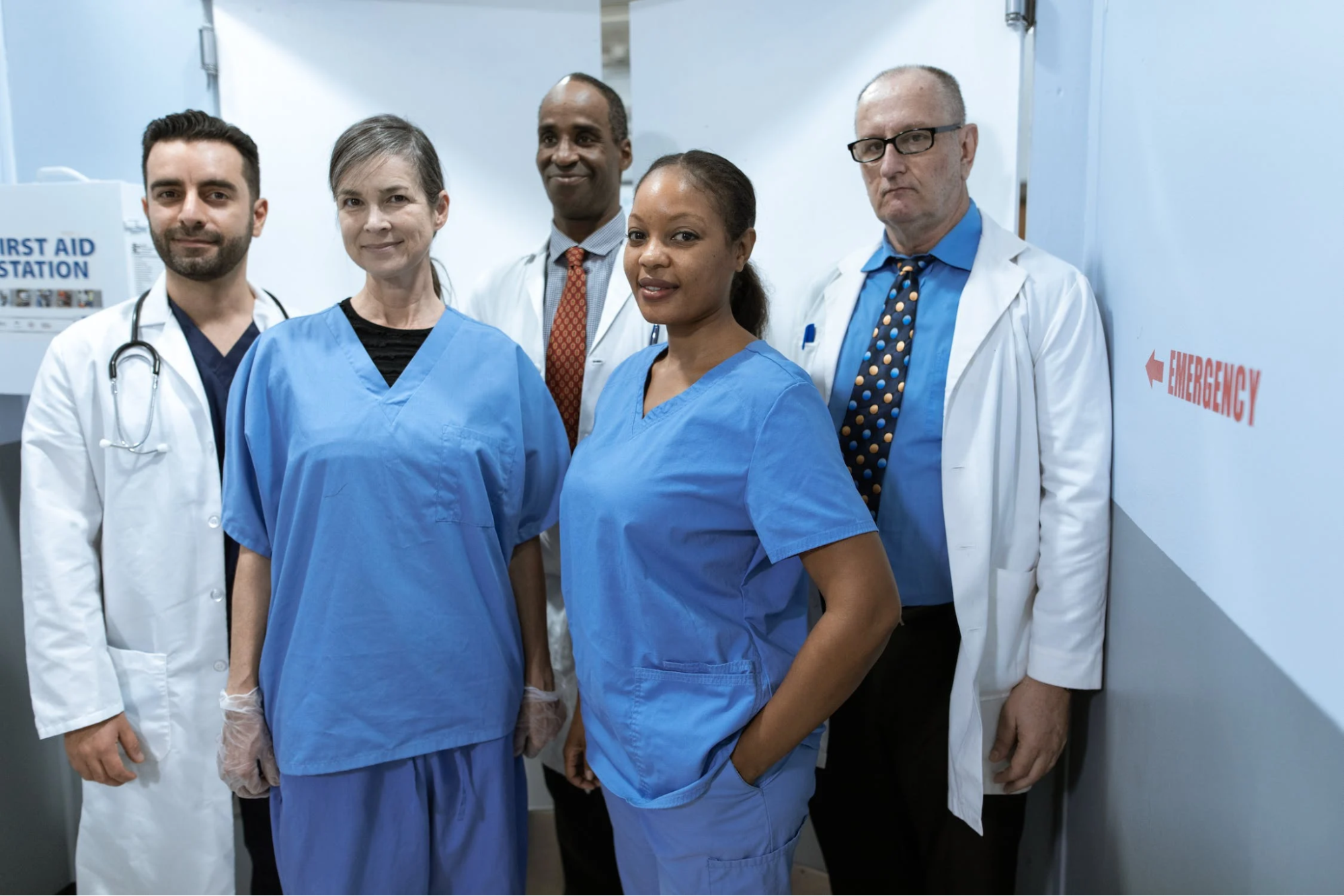 Medical providers standing in a hospital hallway