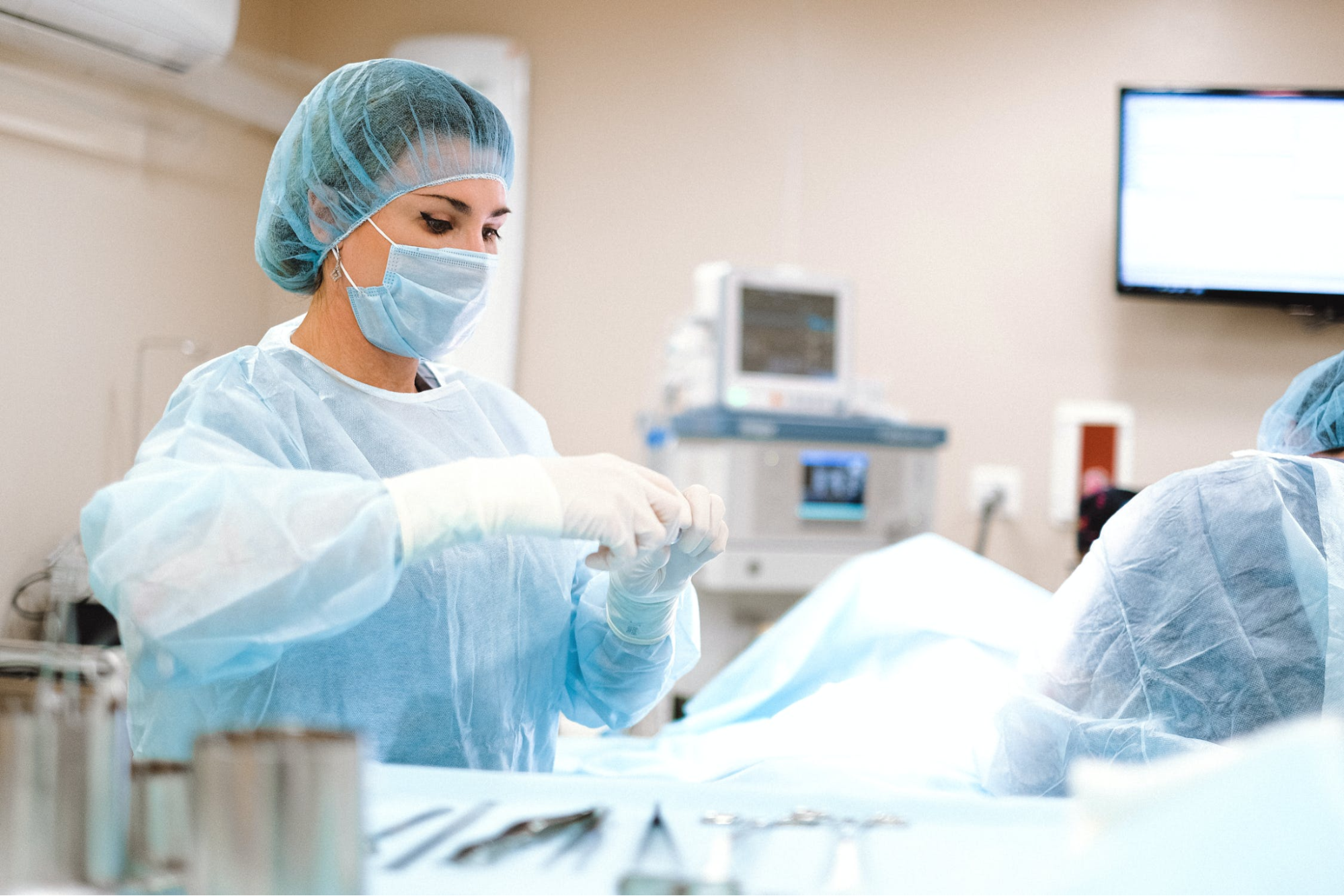 Woman in PPE in an operating room