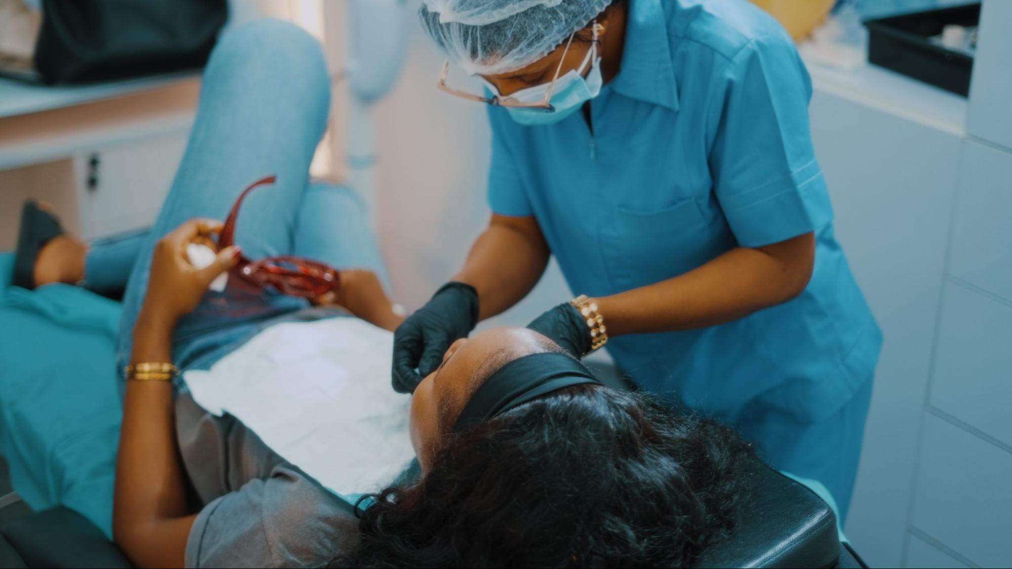 Dental Hygienist setting a patient up