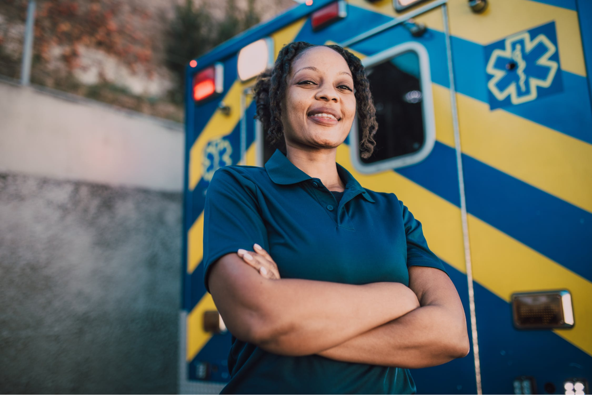 Woman standing in front of an ambulance