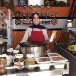 a woman making crepes