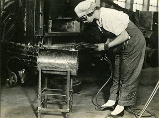 Woman working on a welding project in 1919