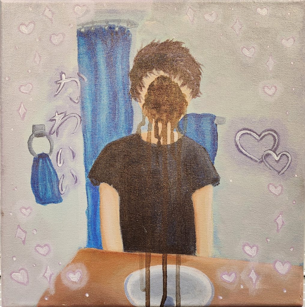 A figure is standing behind a brown counter and white sink. They have dark brown hair and a black shirt. A large dark brown spot covers their face, the brown dripping down to the bottom of the piece. They are in front of a light gray wall, blue towels, and a blue shower curtain. Pink and white hearts and sparkles surround them. There is Japanese script on the left.