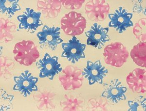 Blue stamped flowers with pointed petals create an 'X' across the piece, overlapping once in the middle. Pink stamped flowers with rounded petals fill the negative space in between, not overlapping.