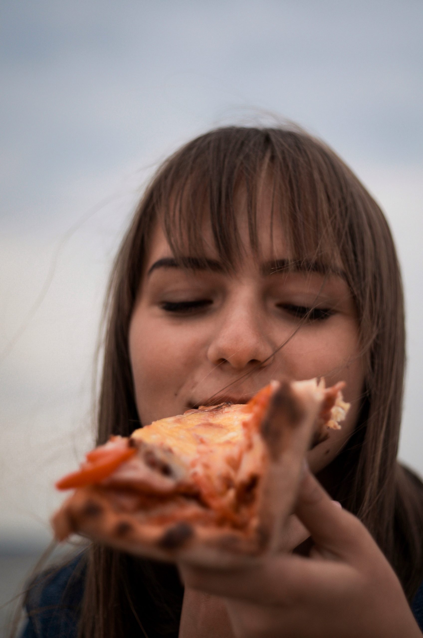 Girl eating pizza