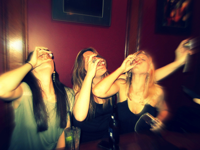 Teen girls taking shots together