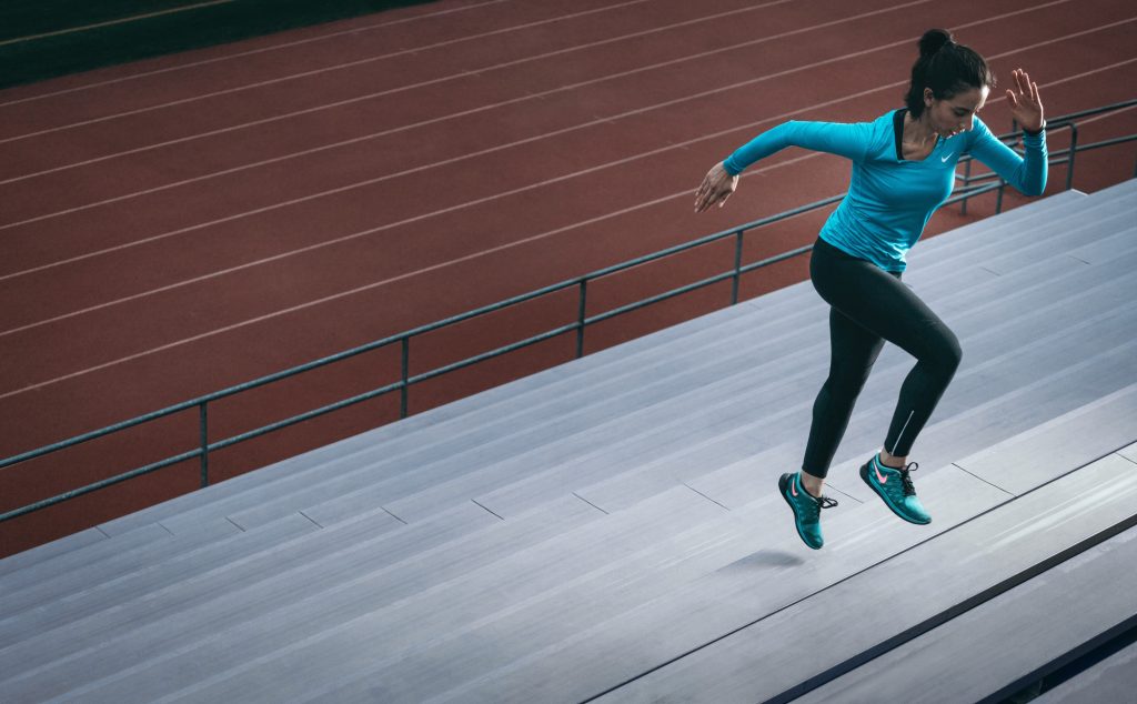 Woman running up stairs