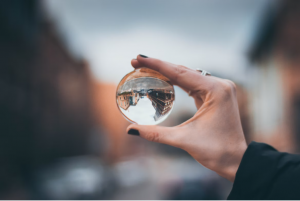 Photo of person holding glass ball