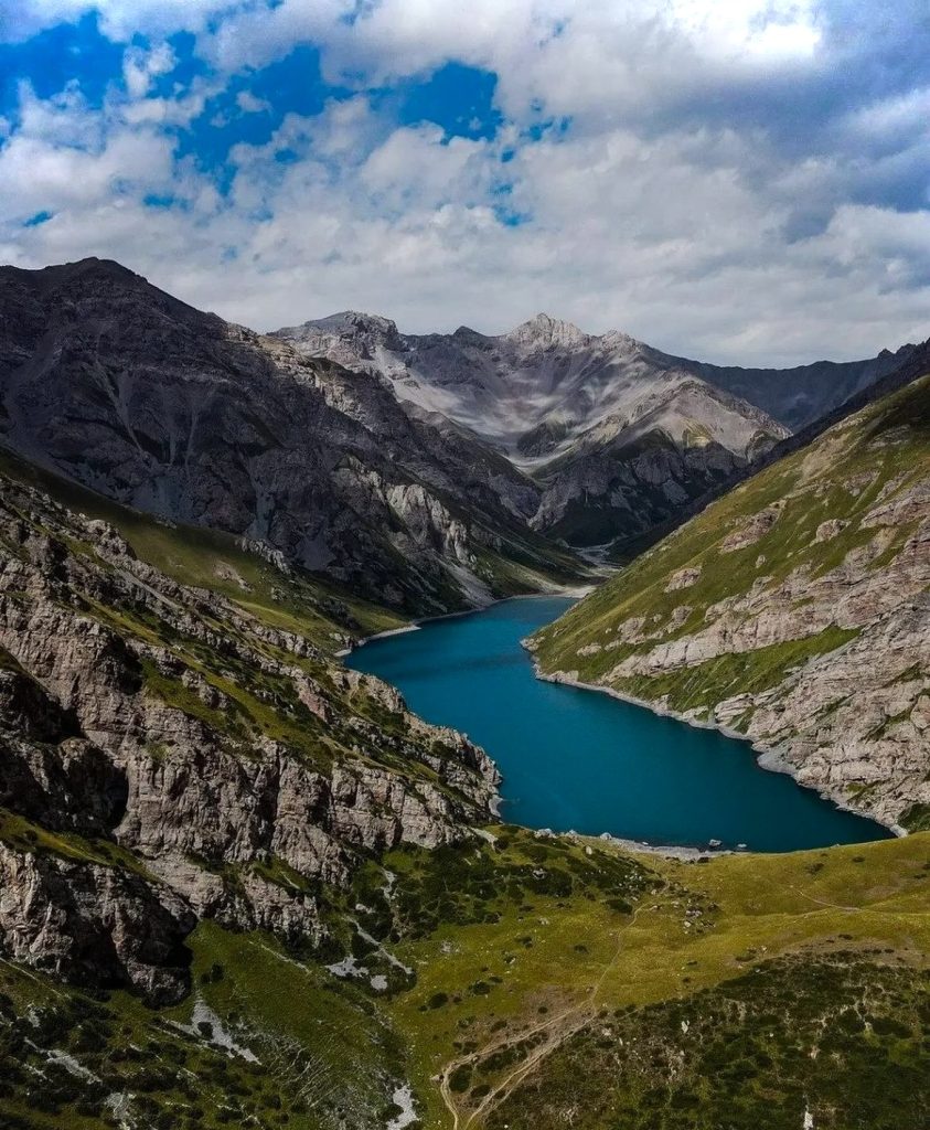 Photo of river valley between mountain peaks
