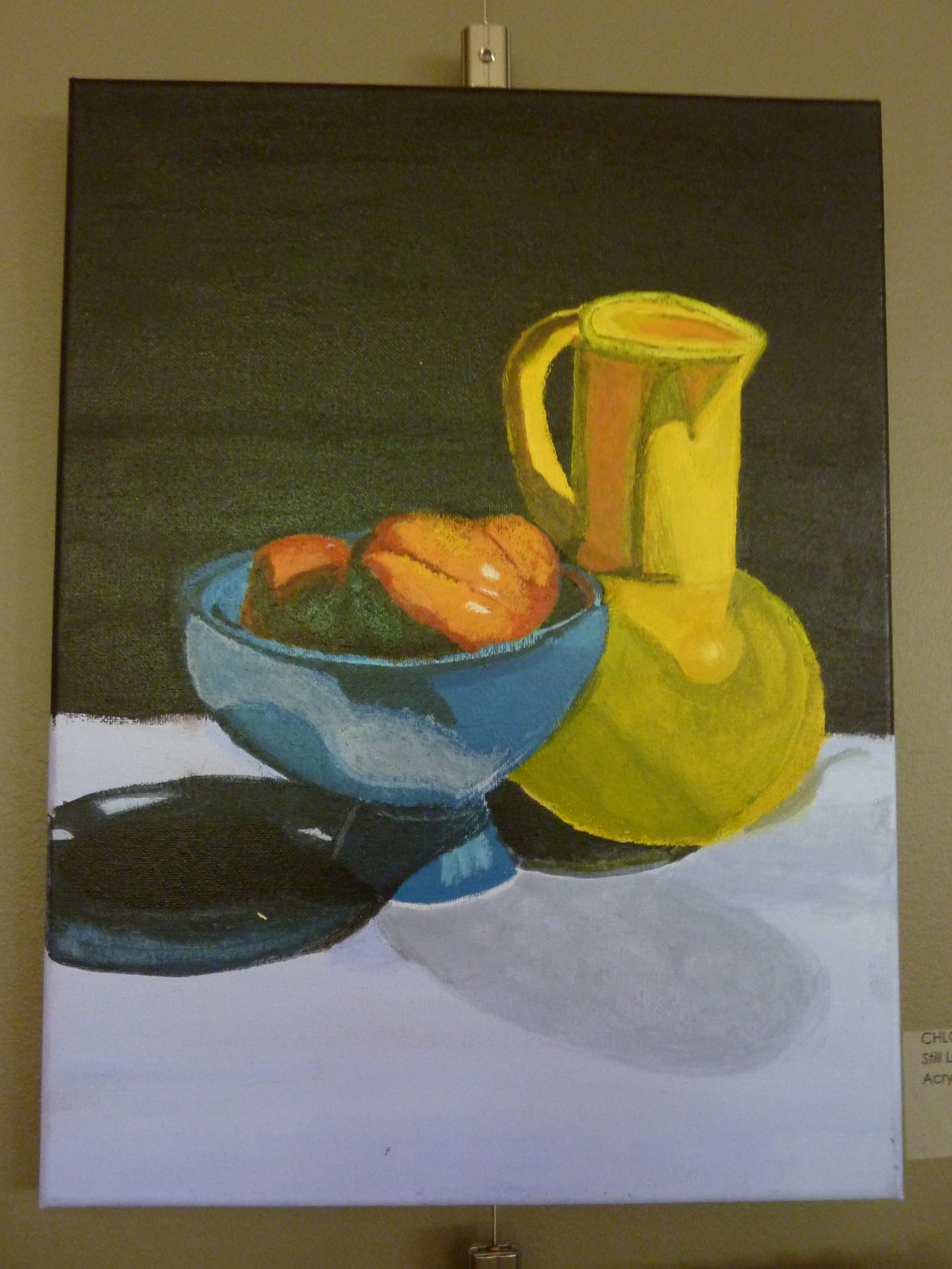 Acrylic artwork of a yellow jug with a handle and a blue vase with peaches on a table with a dark green background