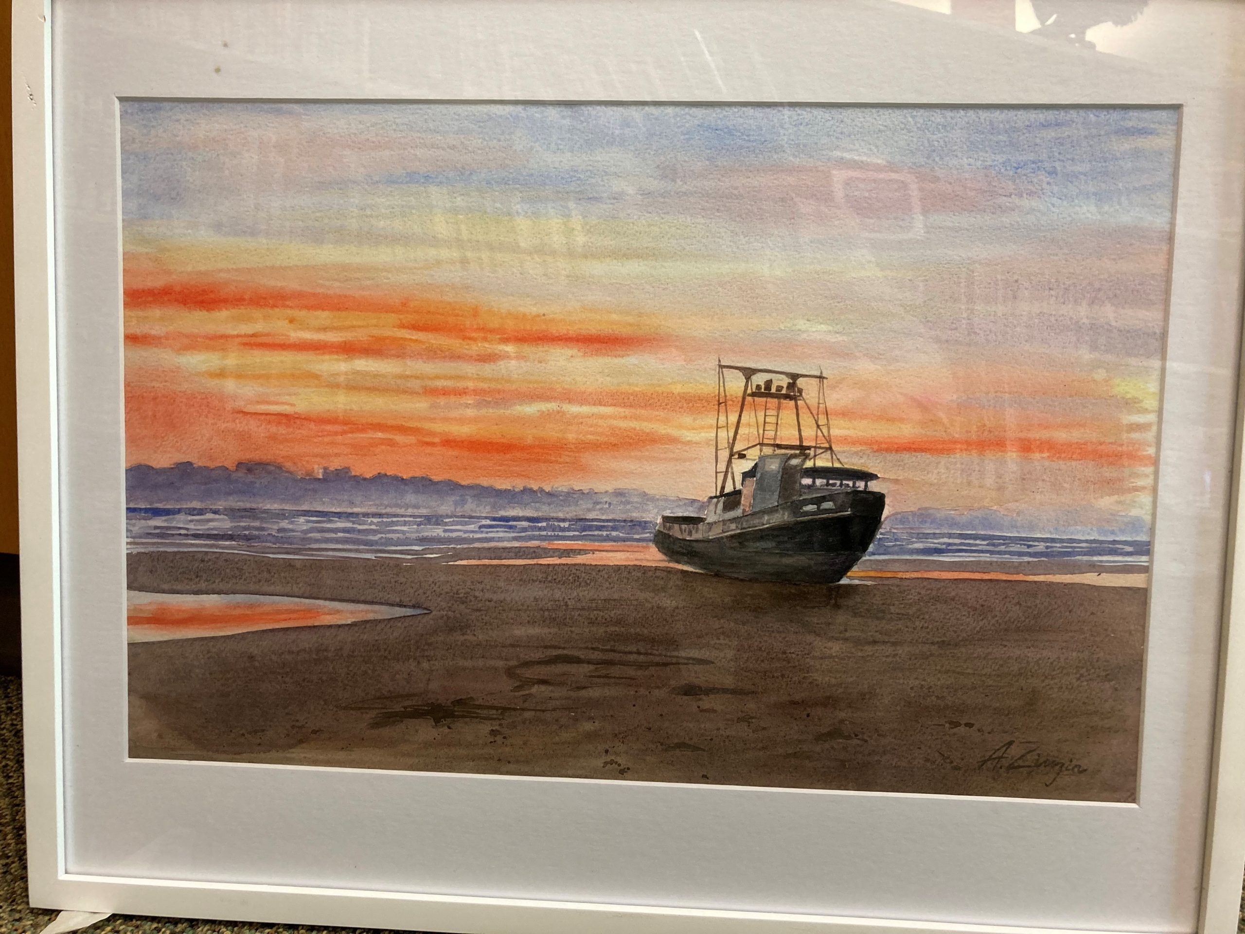 Watercolor painting of a boat beached on a sandy shoreline at sunset