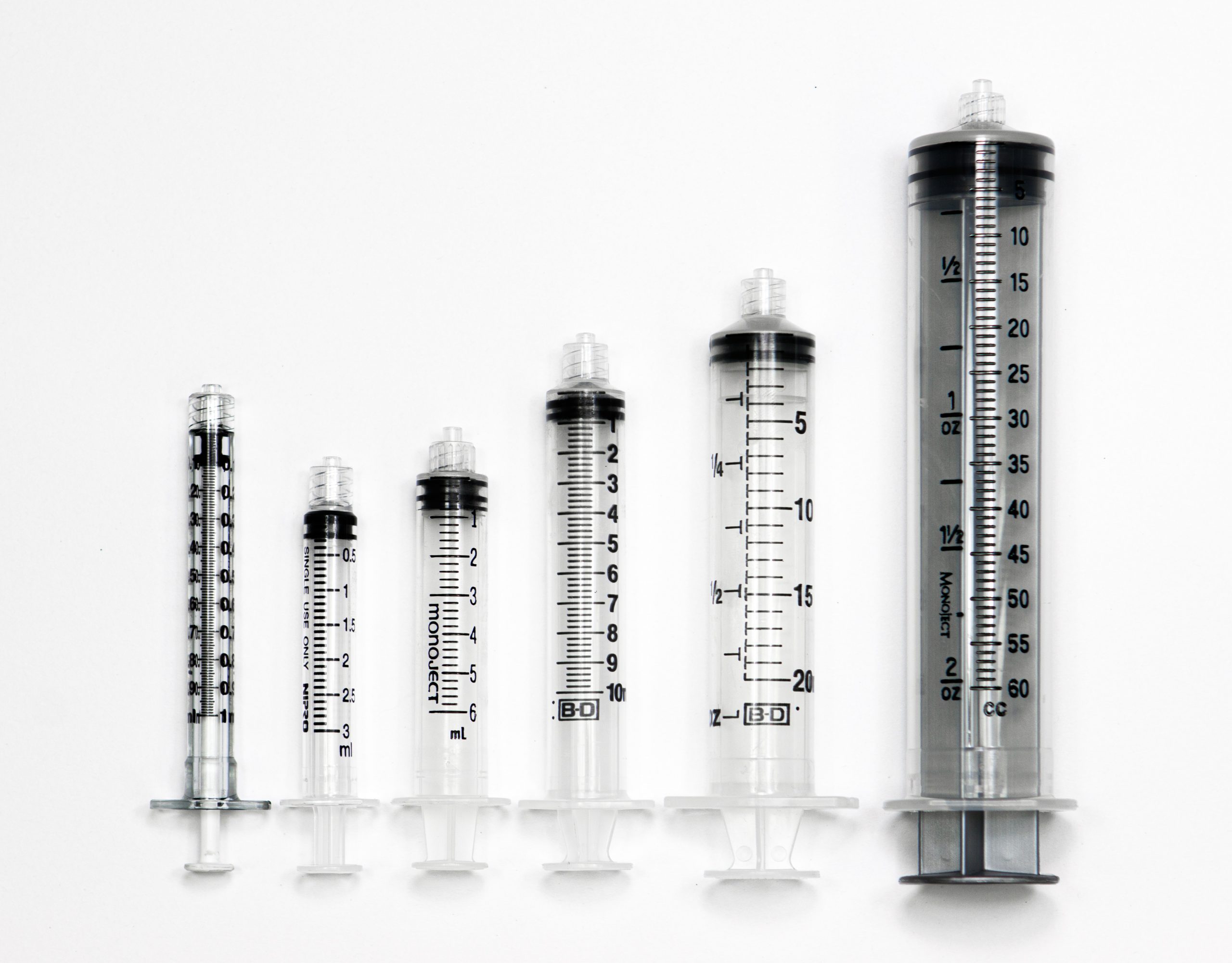 Photo showing six syringes, of various sizes