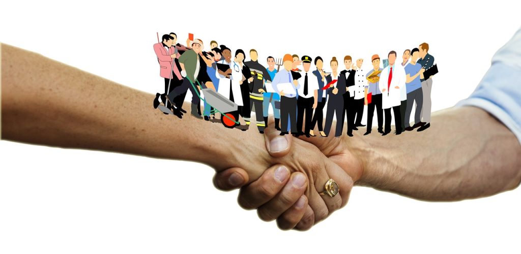 Image showing clip art people standing on top of two arms that are connected in a handshake