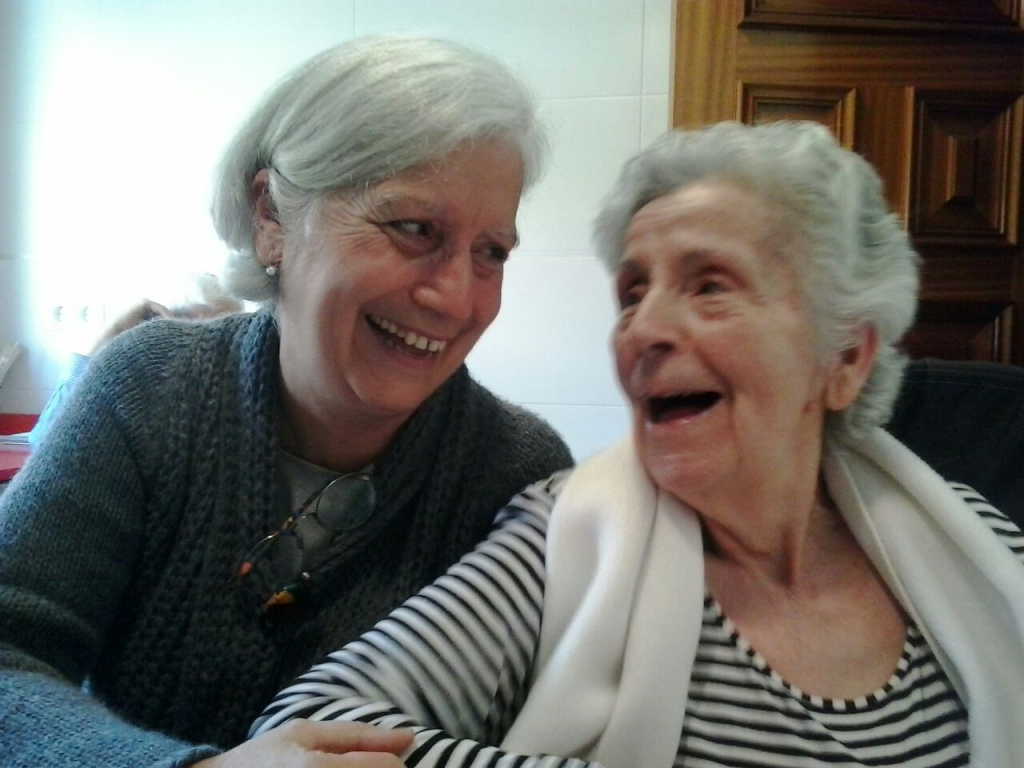Image showing two older women sitting next to each other and laughing