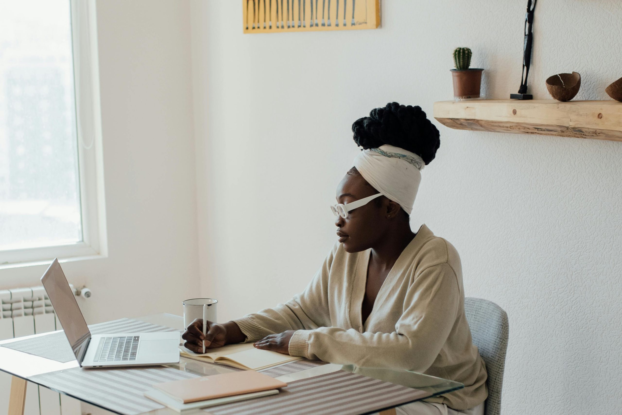 photo of a woman working on a laptop