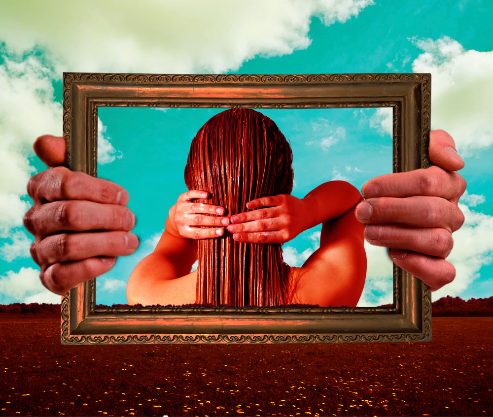 Image of hands holding picture frame with back of female's head with hands holding hair